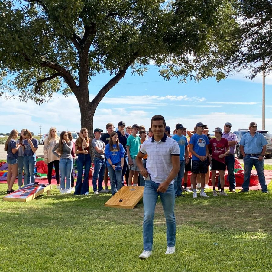 Wall students participate in the corn hole tournament at the St. Ambrose Fall Festival.