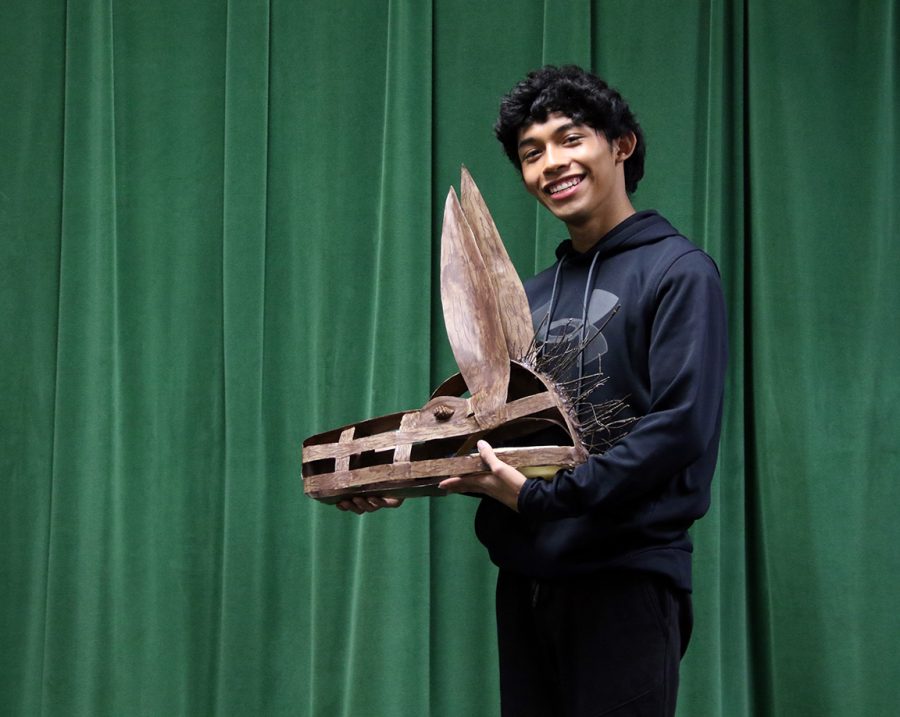Senior Mickey Villedas pictured with his hand-crafted donkey head. The piece was made using worbla, a thermal plastic that can be easily molded. Villedas complimented the wooden texture by adding a mane made of twigs and acorns for eyes.