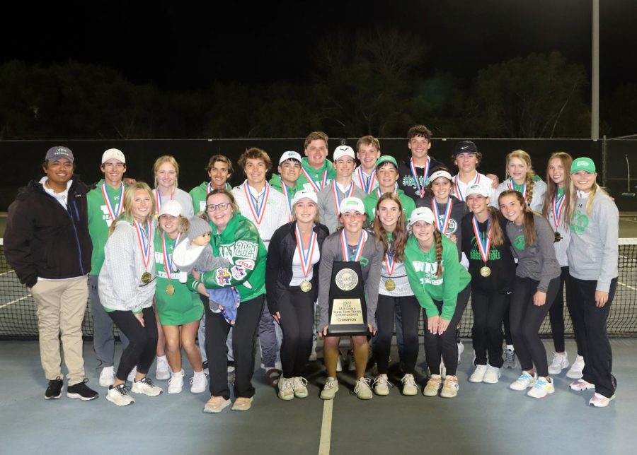 Members of the state team tennis championship team pose for a photo after the trophy presentation.