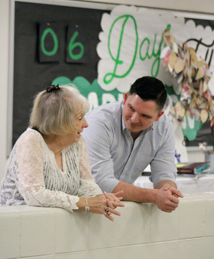 Sharon Haney and her son chat at her retirement party.