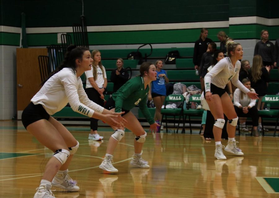 Seniors Brooke Lehr and Kamryn Williams stand ready to play defense. Both players are committed to play collegiate volleyball after graduation.