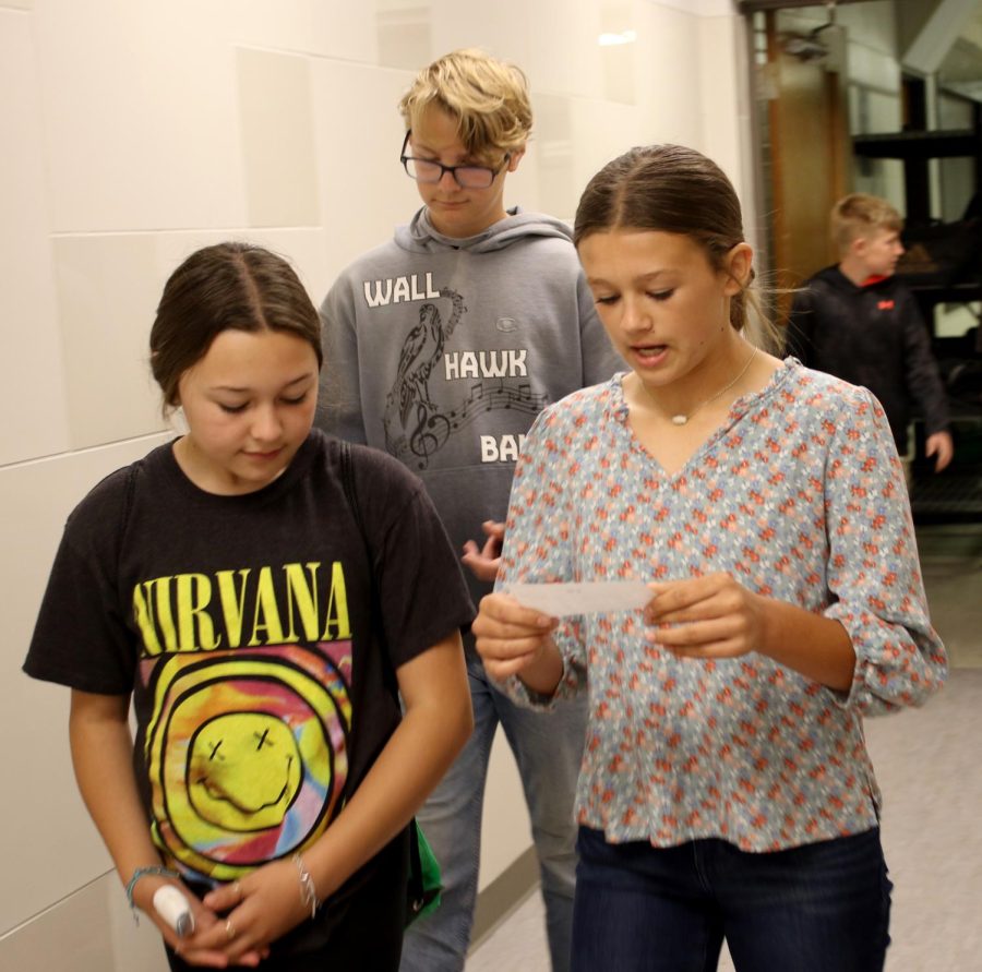 Lexi Killam gives fourth grader Brynnlee Tucker a classroom tour through the middle school halls. 